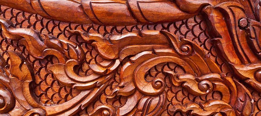 Marvel at Teak wood carvings on your Phuket Cruise