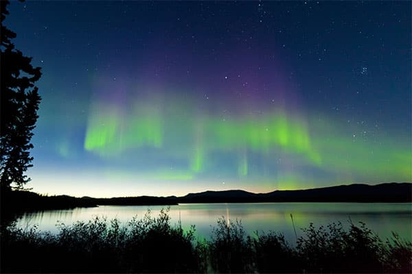 Witness the breathtaking view of the Northern Lights over Alaska