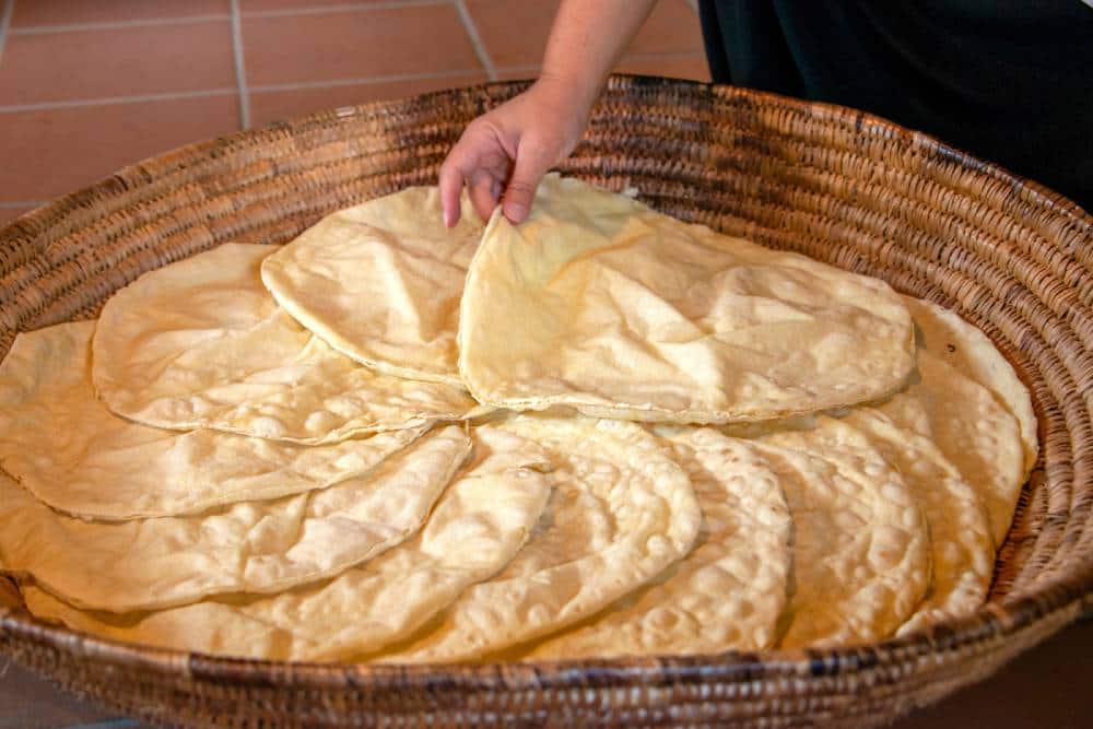 Preparation of Panne Carasau, traditional Sardinian bread