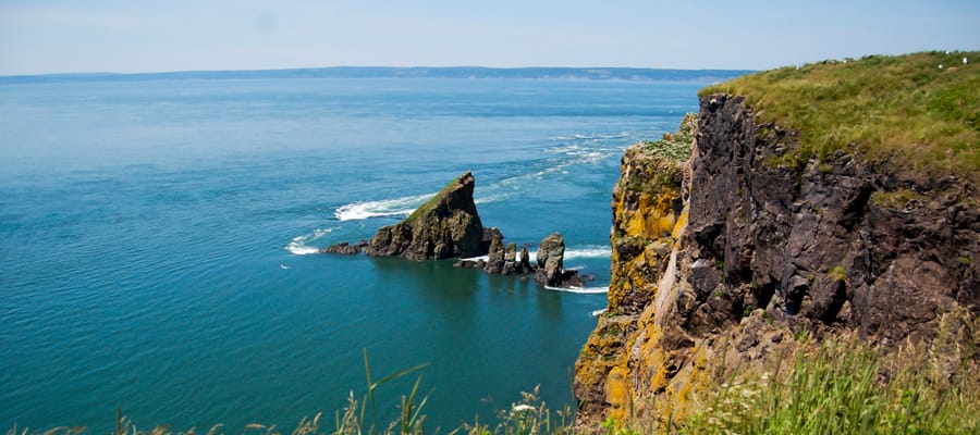 Learn about the Battle of Cape Split whilst hiking the rugged terrain.